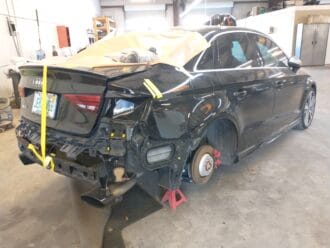 Audi RS3 undergoing collision repair, Right rear quarter view